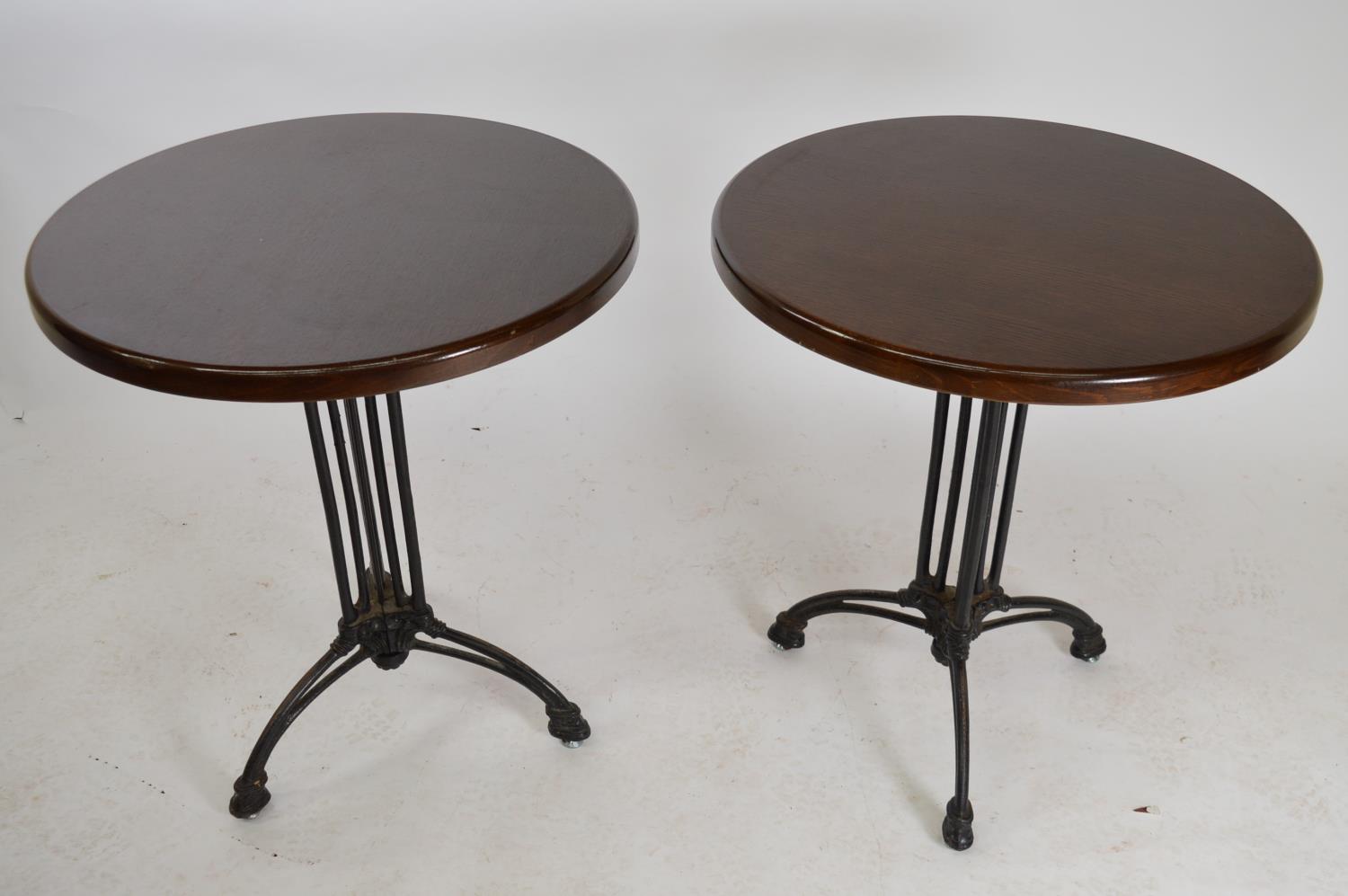 Pair of good quality cast iron pub tables.