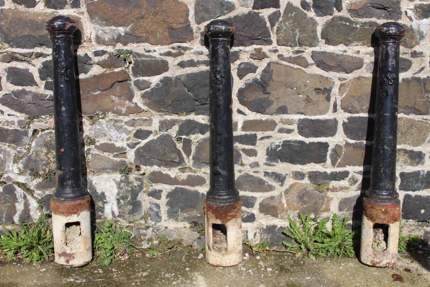 Set of three cast iron bollards