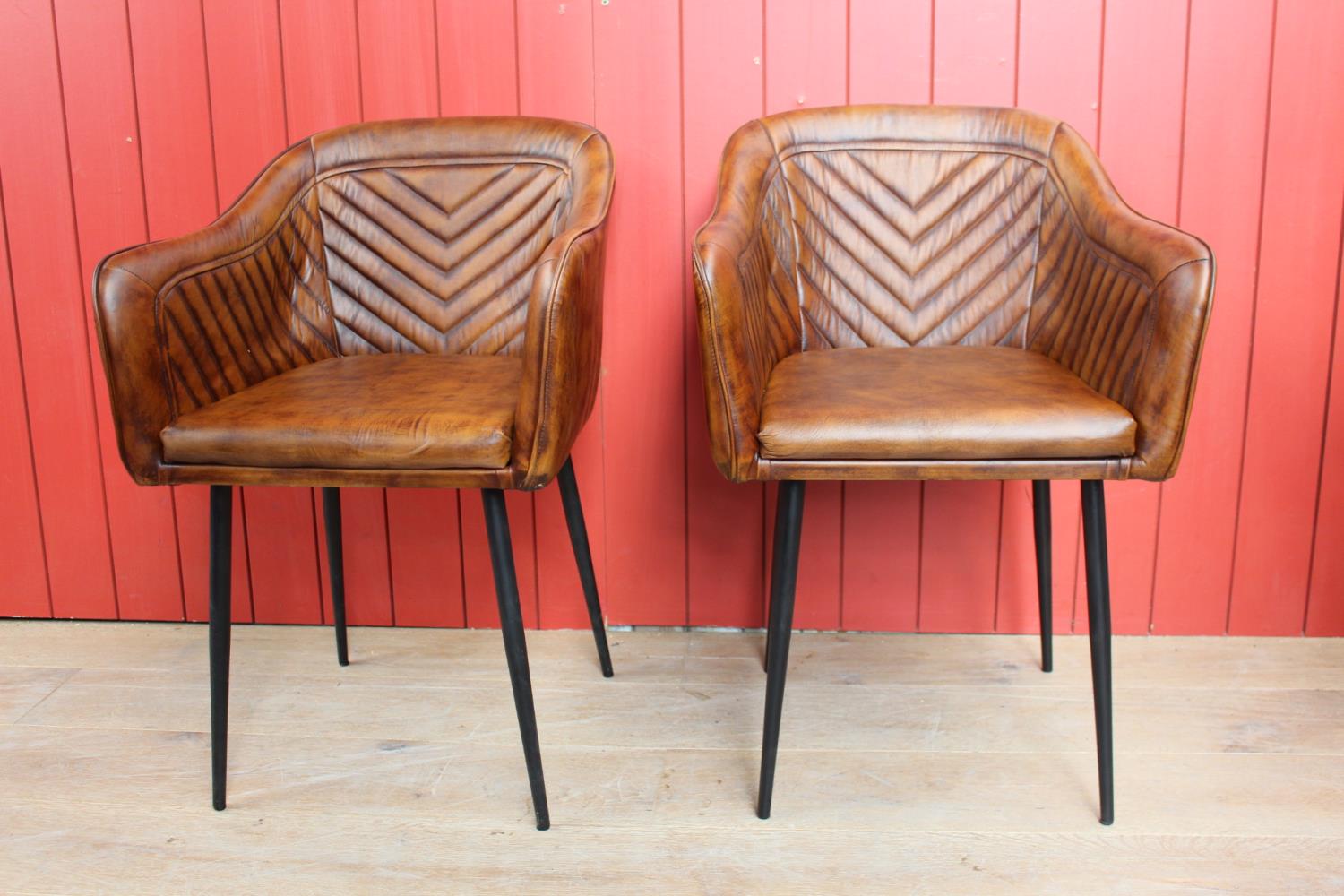 Pair of leather tub chairs