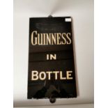 Guinness In A Bottle slate advertising sign.