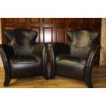 Pair of unusual leather upholstered armchairs