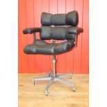 Leather upholstered white metal swivel office chair.