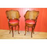 Pair of leather upholstered swivel high chairs