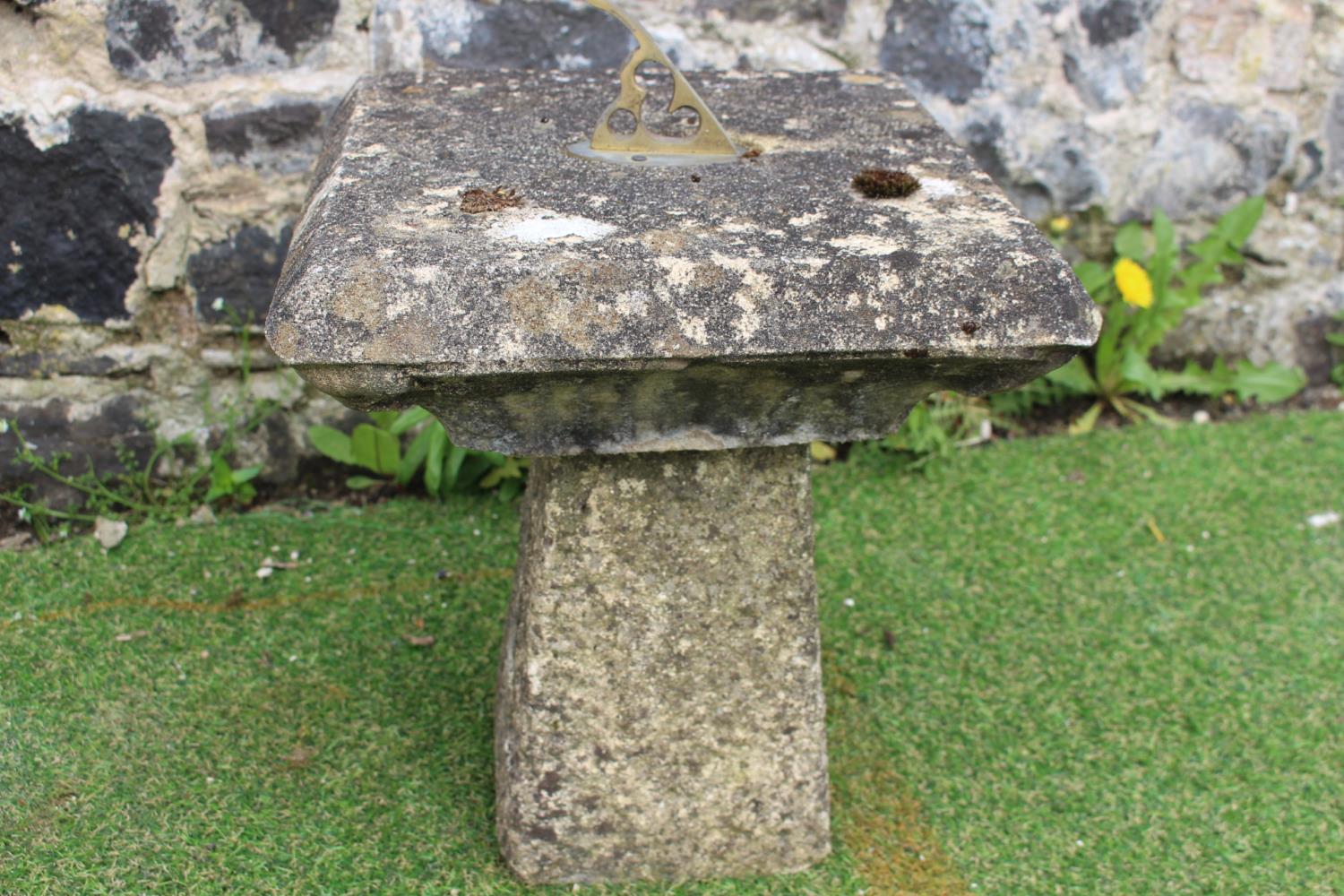 Square top sundial with brass fittings.