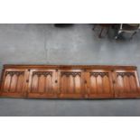 Pitch pine panel in five sections in the Gothic Style.