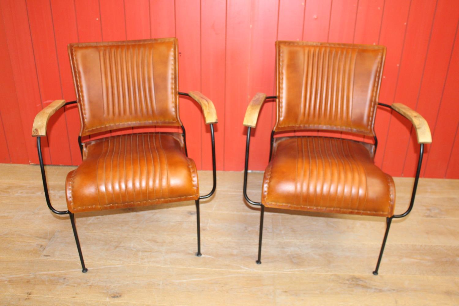 Pair of leather upholstered metal framed Baker's chairs