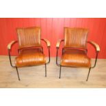 Pair of leather upholstered metal framed Baker's chairs