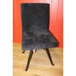 Black velvet upholstered swivel chair