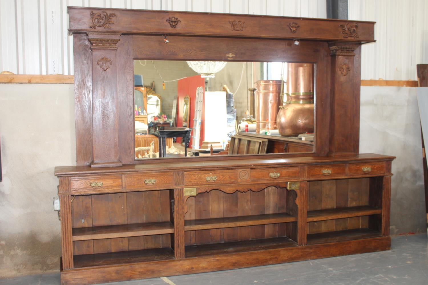 Oak shop counter and oak mirrored bar back.