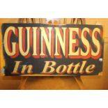 Guinness in a Bottle metal advertising sign