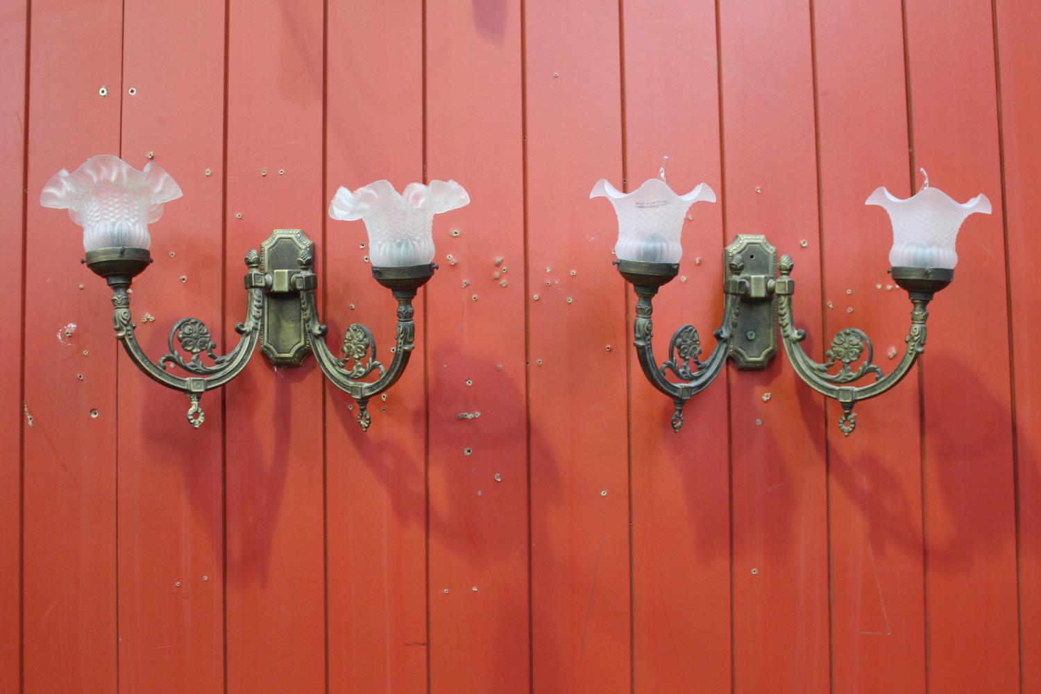 Pair of two branch brass wall sconces