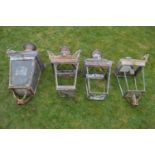 Set of four wrought iron and copper lanterns.