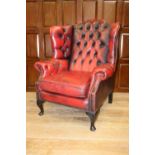 Leather upholstered wing backed armchair