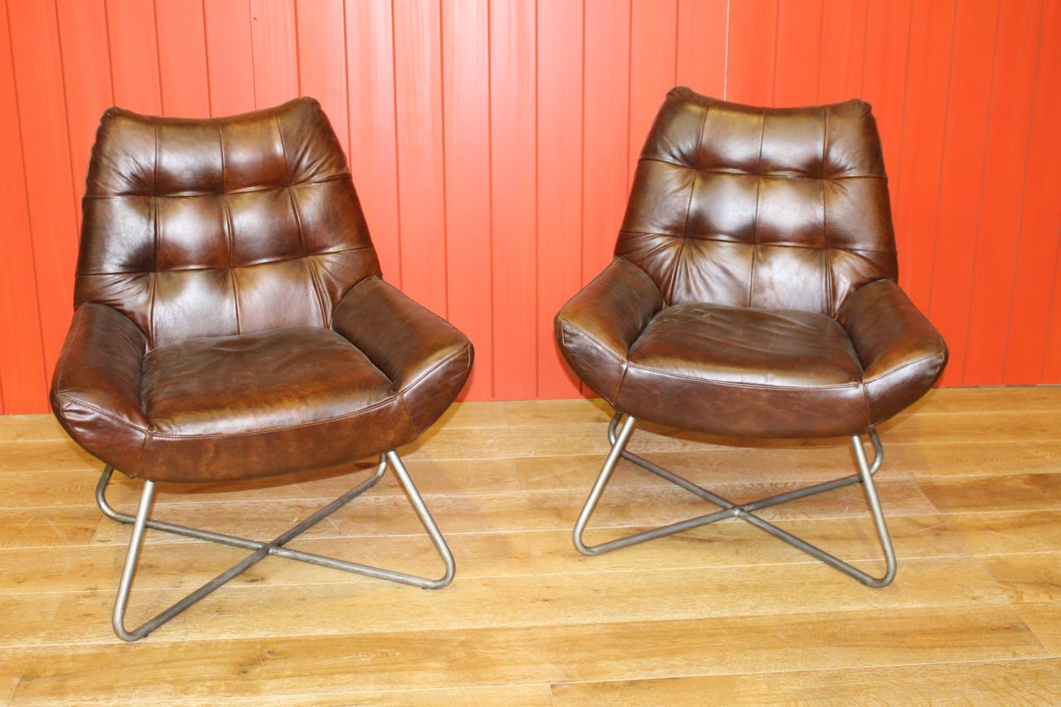 Pair of leather upholstered deep buttoned back chairs