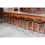 Set of five white metal high stools