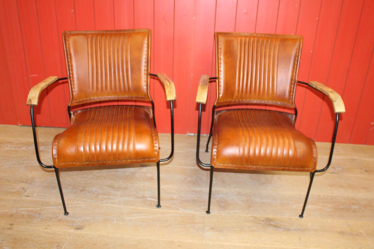 Pair of leather upholstered metal framed Baker's chairs