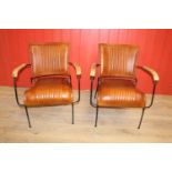 Pair of leather upholstered metal framed Baker's chairs