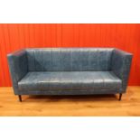 Leather upholstered three seater settee