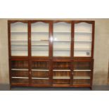 19th C. Mahogany two piece shop display cabinet