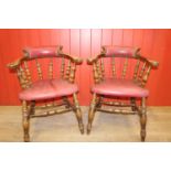 Pair of pine and leather upholstered Captain's chairs.