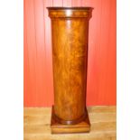 Walnut veneered column.