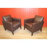 Pair of leather upholstered retro style armchairs