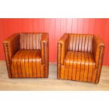 Pair of leather upholstered club chairs