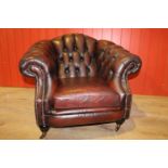 Leather upholstered buttoned back armchair
