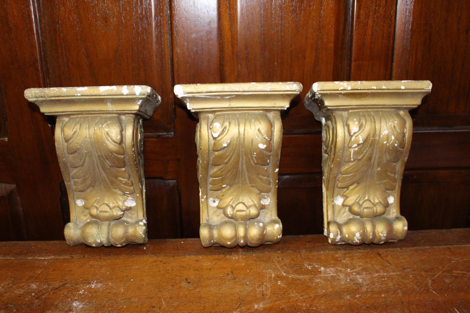 Three plaster corbels