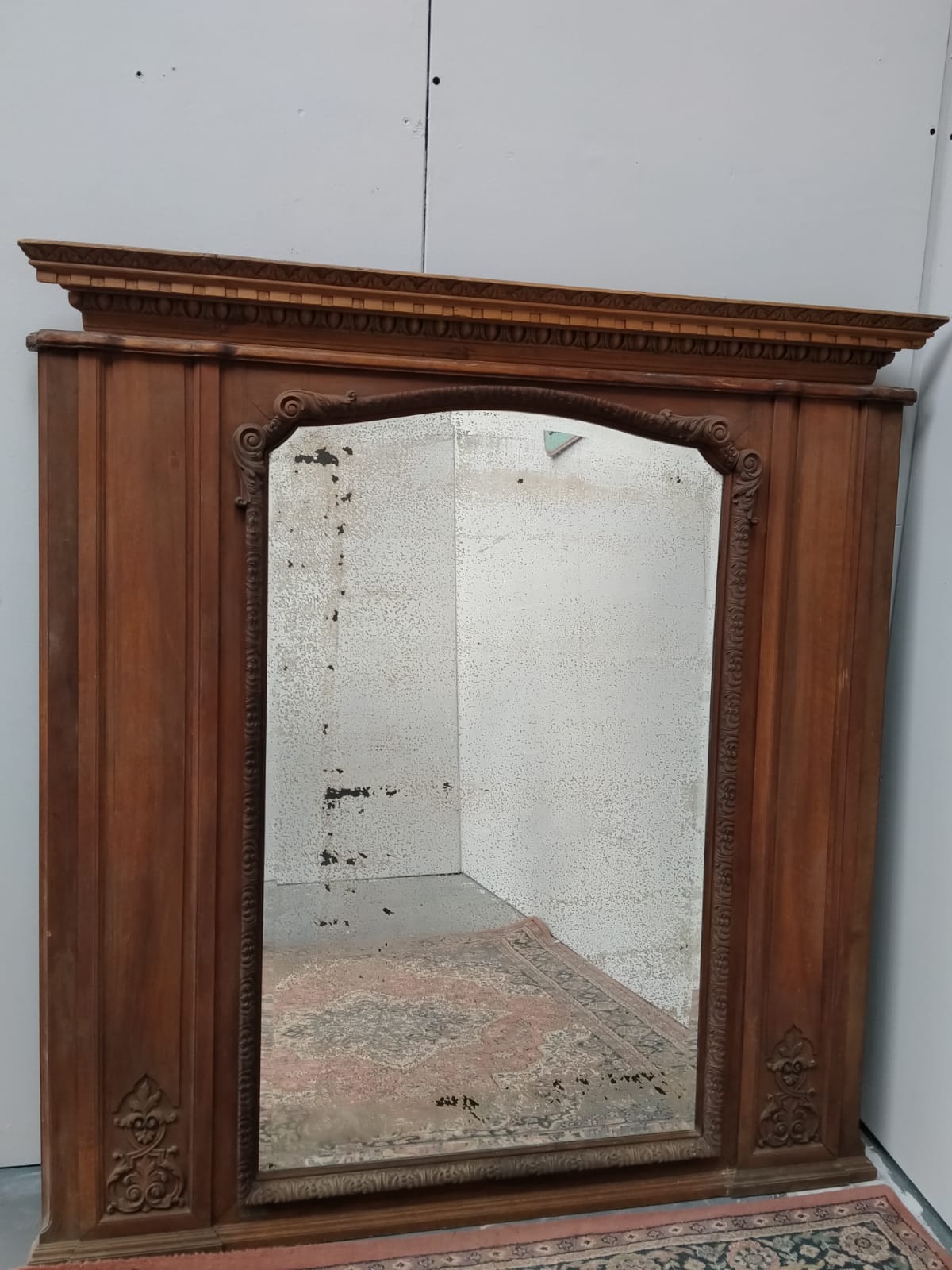 Carved oak wall mirror.