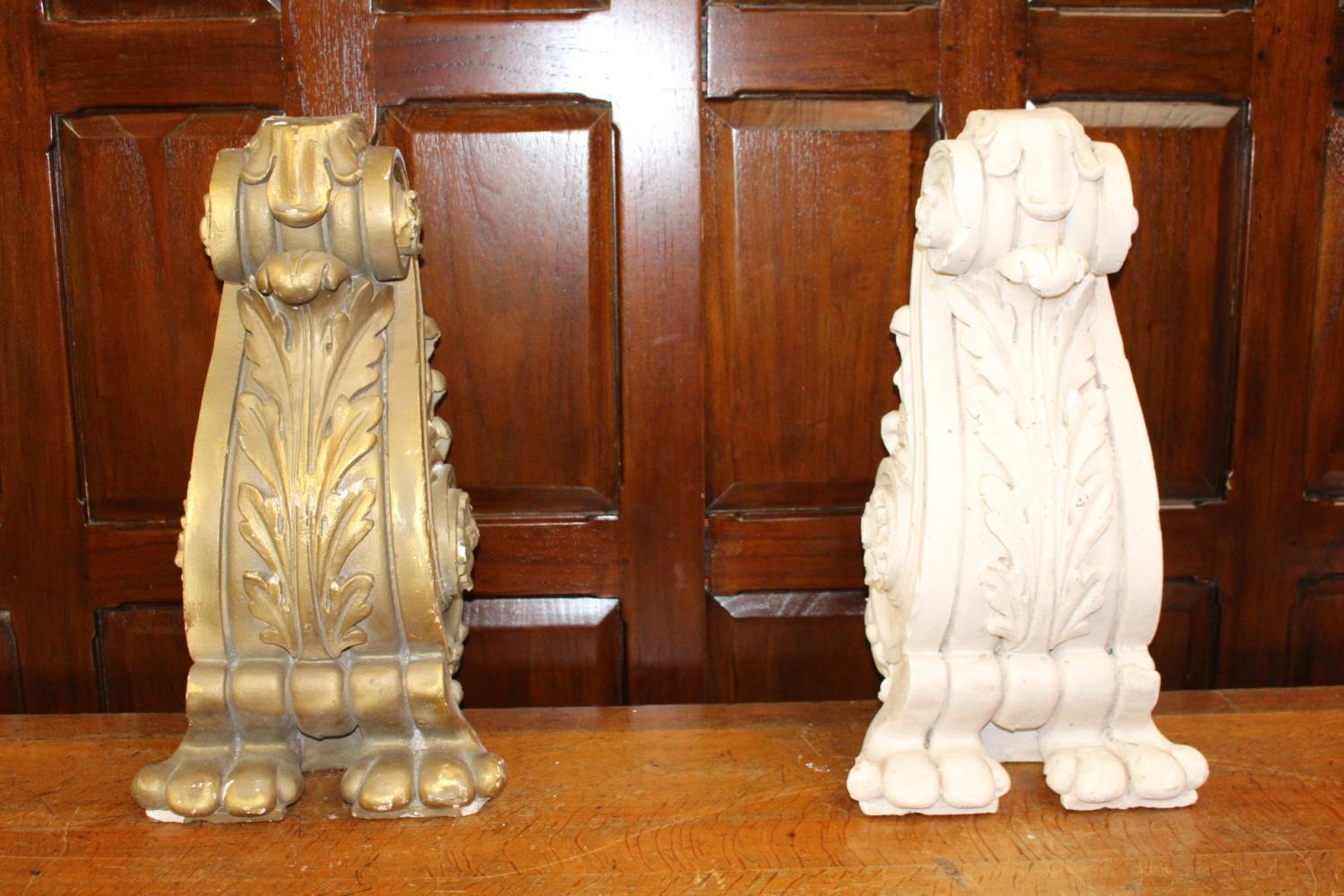 Two plaster corbels