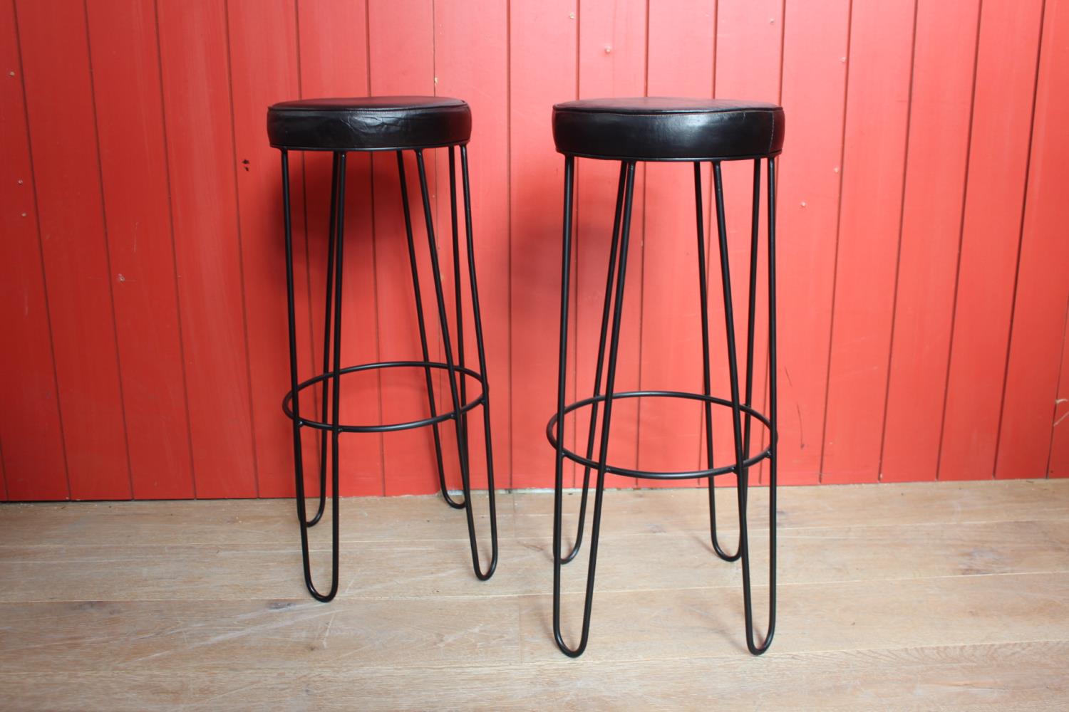 Pair of leather upholstered metal Hairpin stools