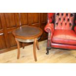 Circular brass bound wooden coffee table