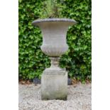 Good quality composition urn on pedestal.