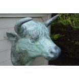 Bronze wall hanging of a Bulls head.