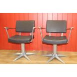 Pair of stylish swivel armchairs