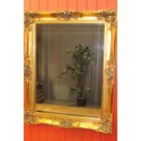 Carved giltwood wall mirror