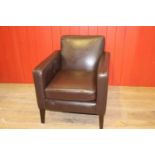 Single leather upholstered retro style armchair.