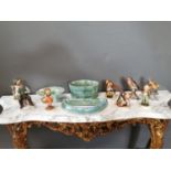 Three pieces of Carrigaline pottery and eight Hummel figures