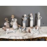 Eight Lladro ceramic figures and models of dogs
