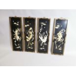 Set of four Japanese ebonised panels