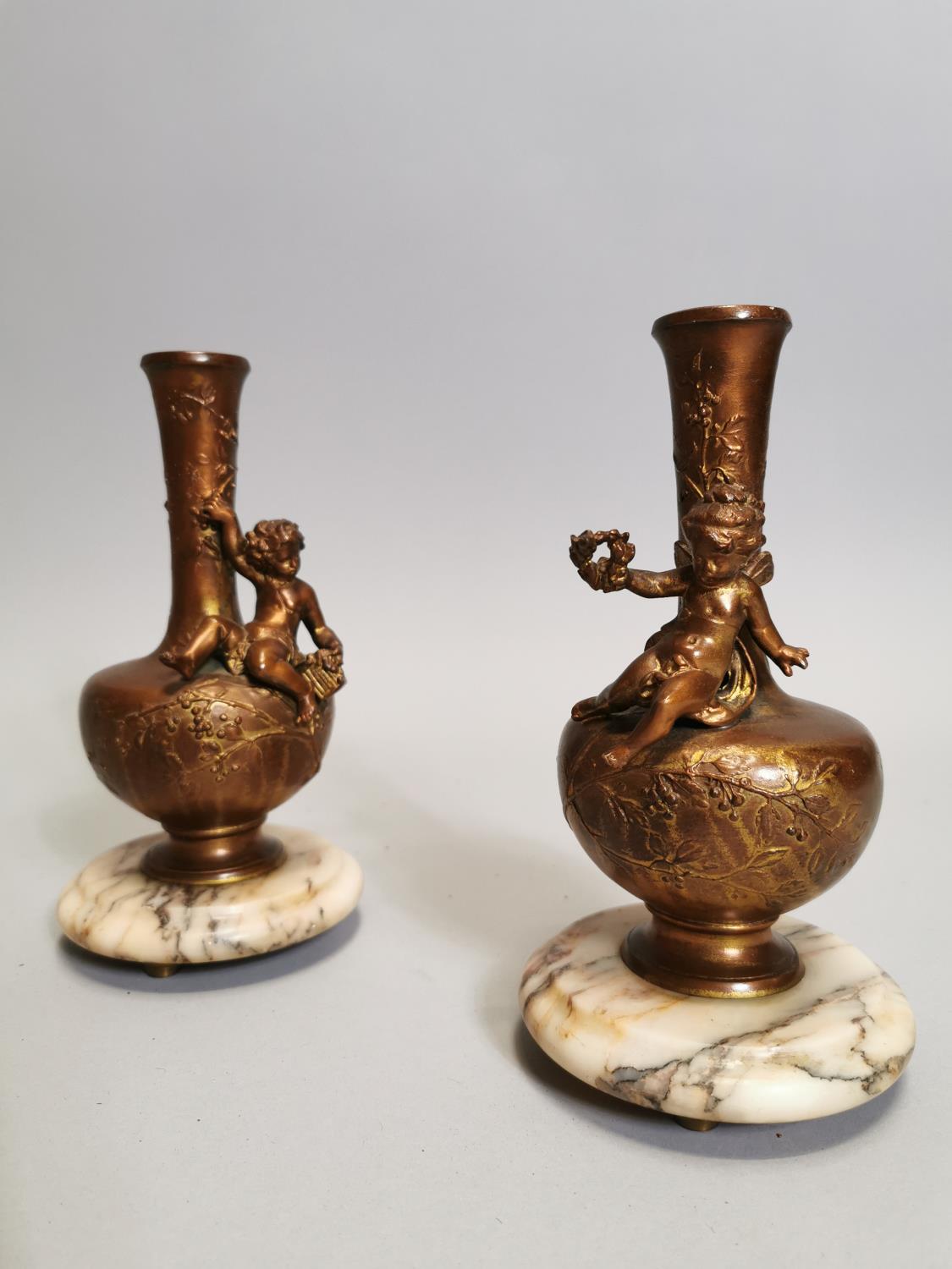Pair of spelter and marble vases