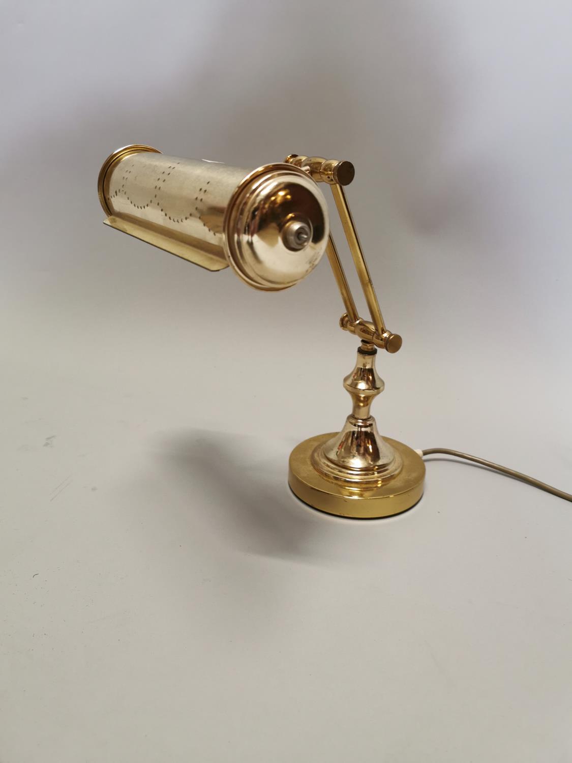 Brass desk lamp.