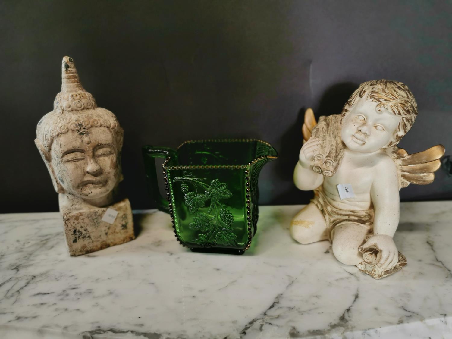 Green glass vase figure of a Buddha and an angel