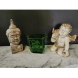 Green glass vase figure of a Buddha and an angel