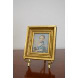 Miniature portrait of a young girl holding cat mounted in gilt frame. {13 cm H x 12 cm W}.