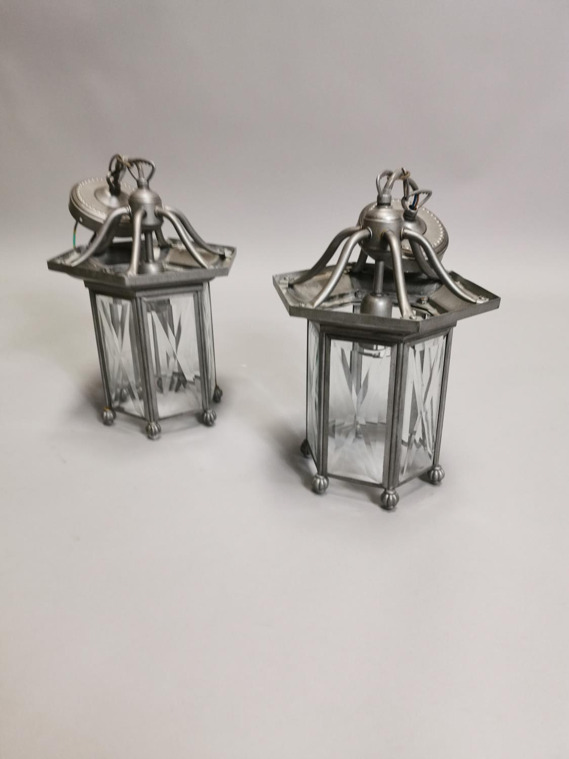 Two metal lanterns.