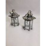 Two metal lanterns.