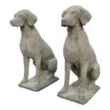 Pair of moulded stone models of Seated Dogs
