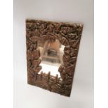 Decorative early 20th. C. carved oak wall mirror.